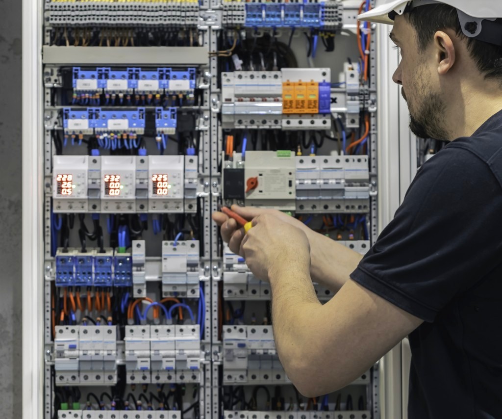 Close-up of labelled distribution boards and three-phase breakers.