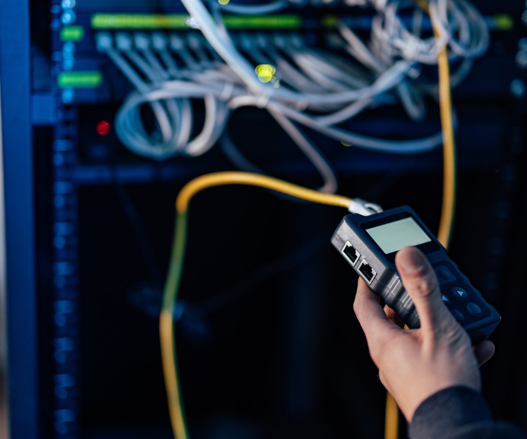 Engineer testing network cables