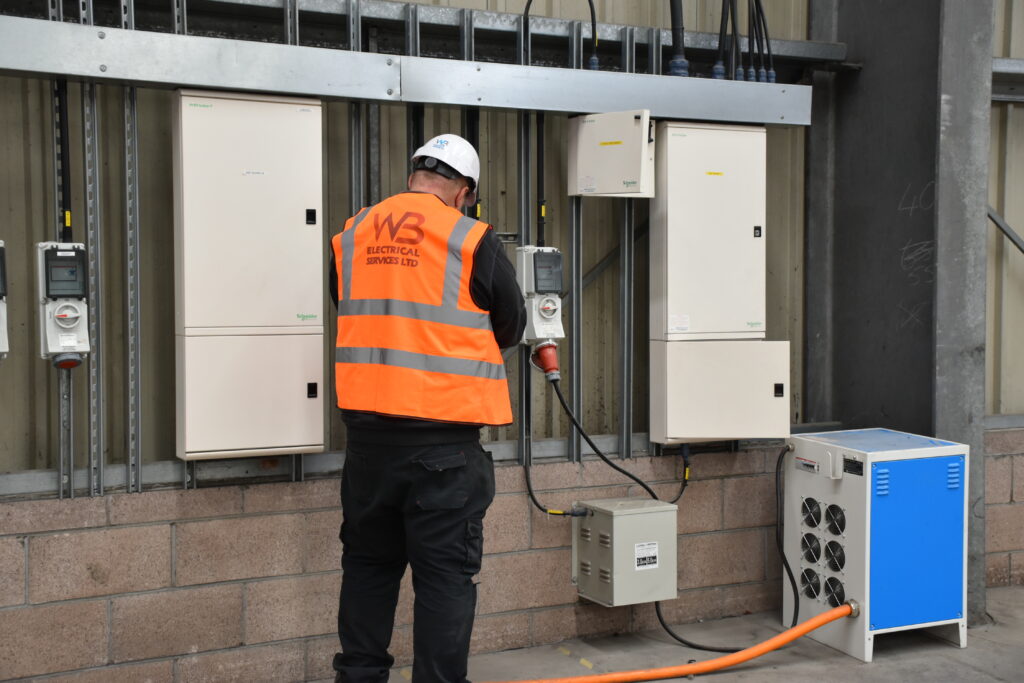 An electrical engineer working on a reactive maintenance project