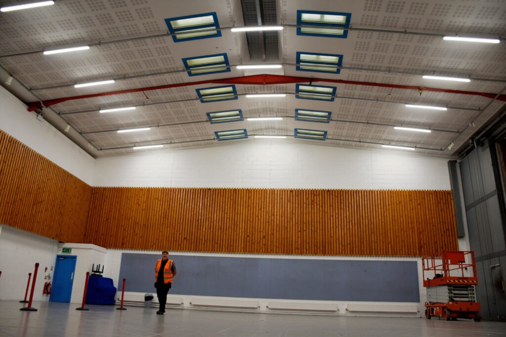 Engineer checking lighting retrofit quality