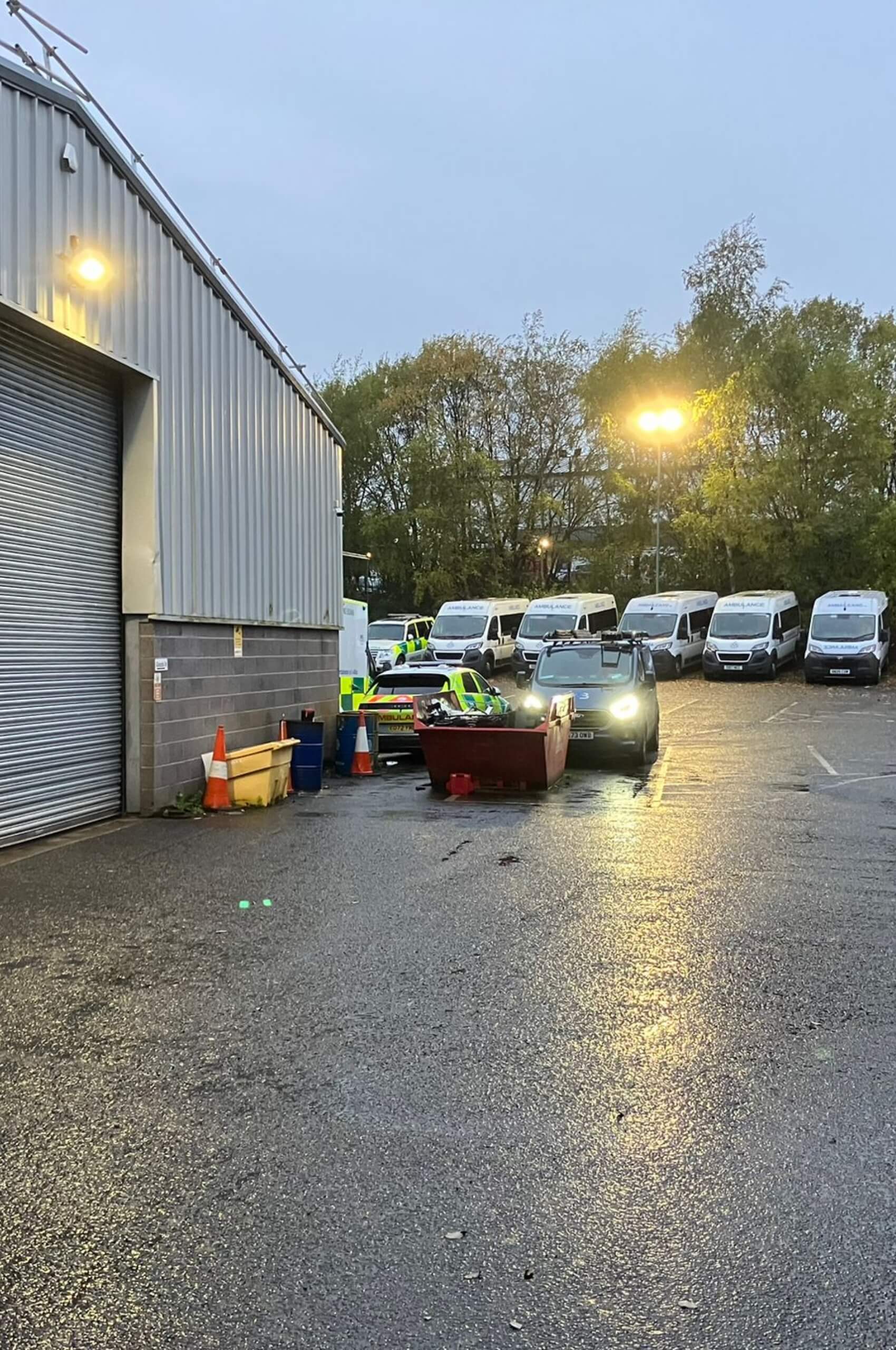 Industrial yard security lighting at dusk, improved visibility for vehicles and staff