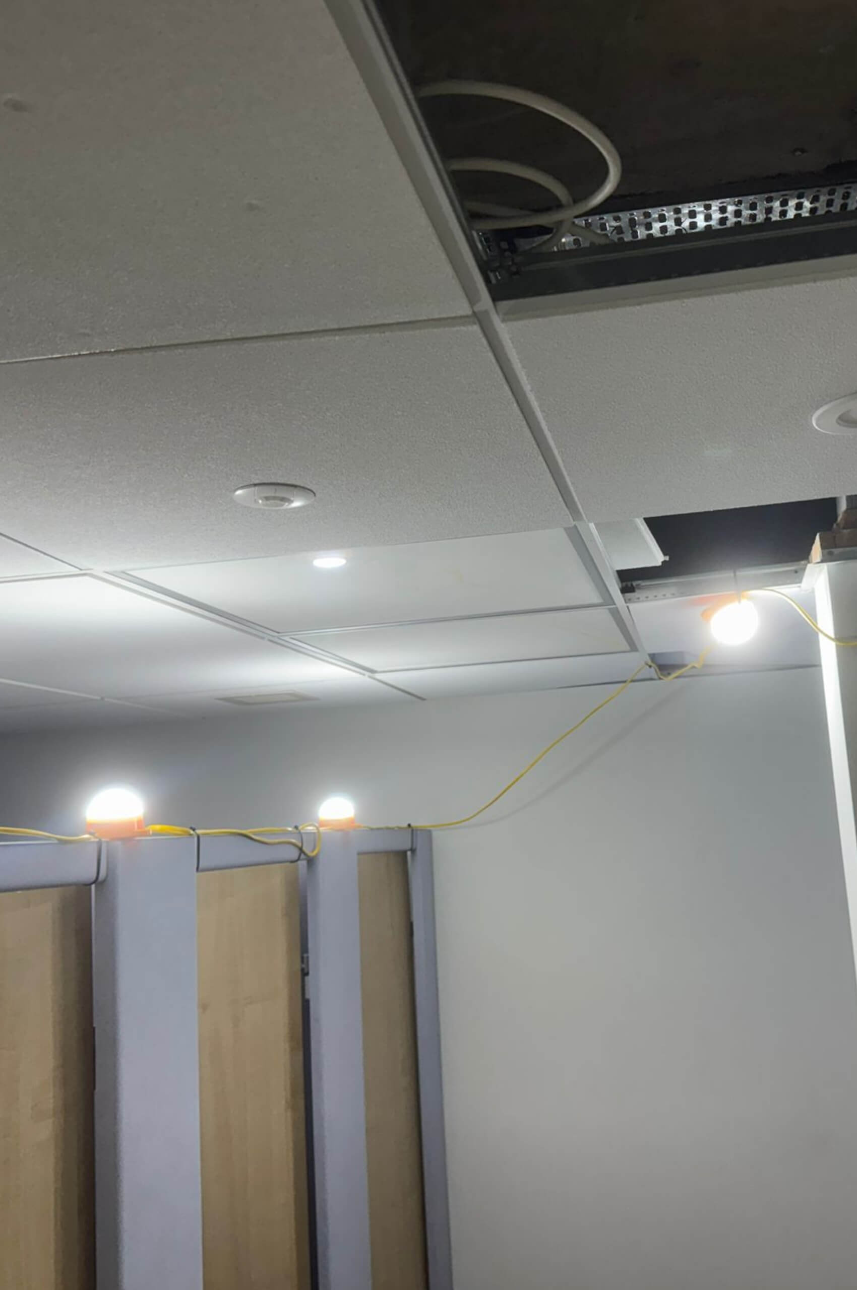 Temporary task lighting installed during fit out works, practical lighting for working areas