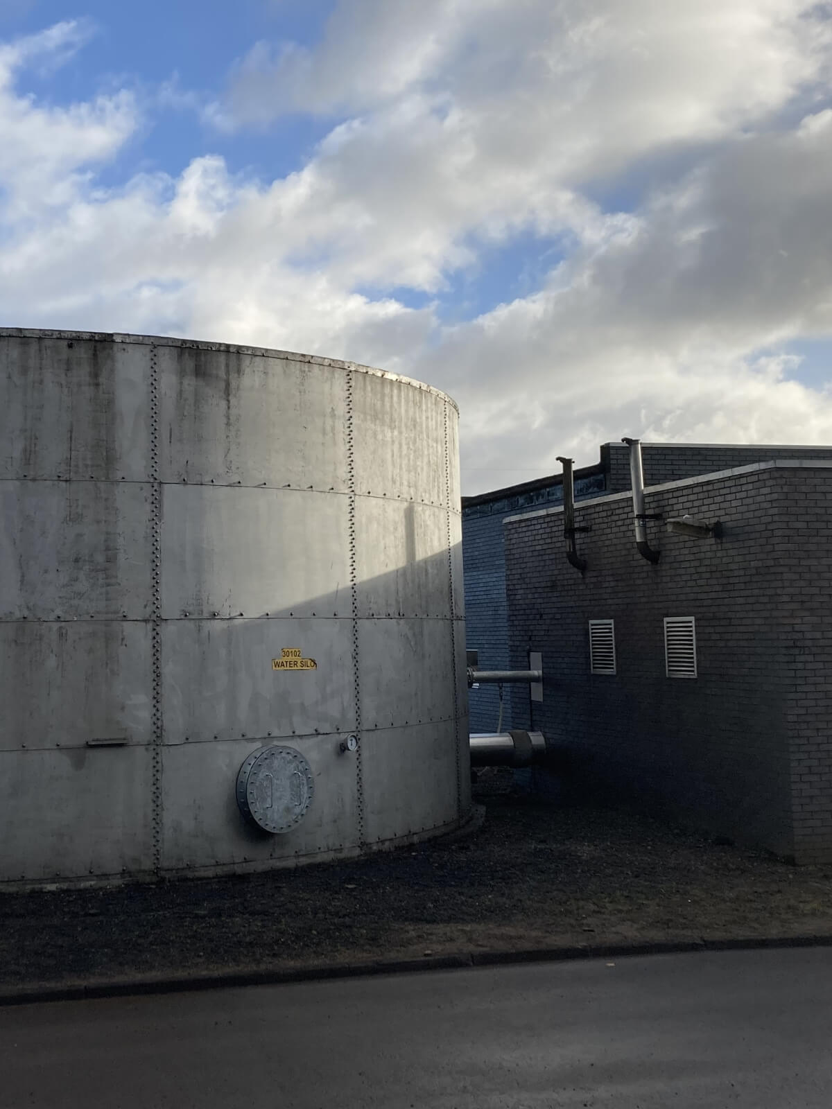 External process vessel and operational buildings at a Scottish distillery site