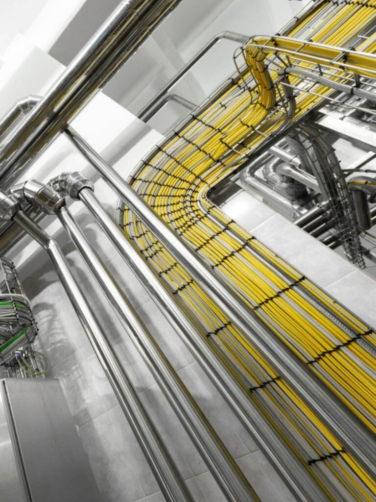 yellow network cable installation within containment