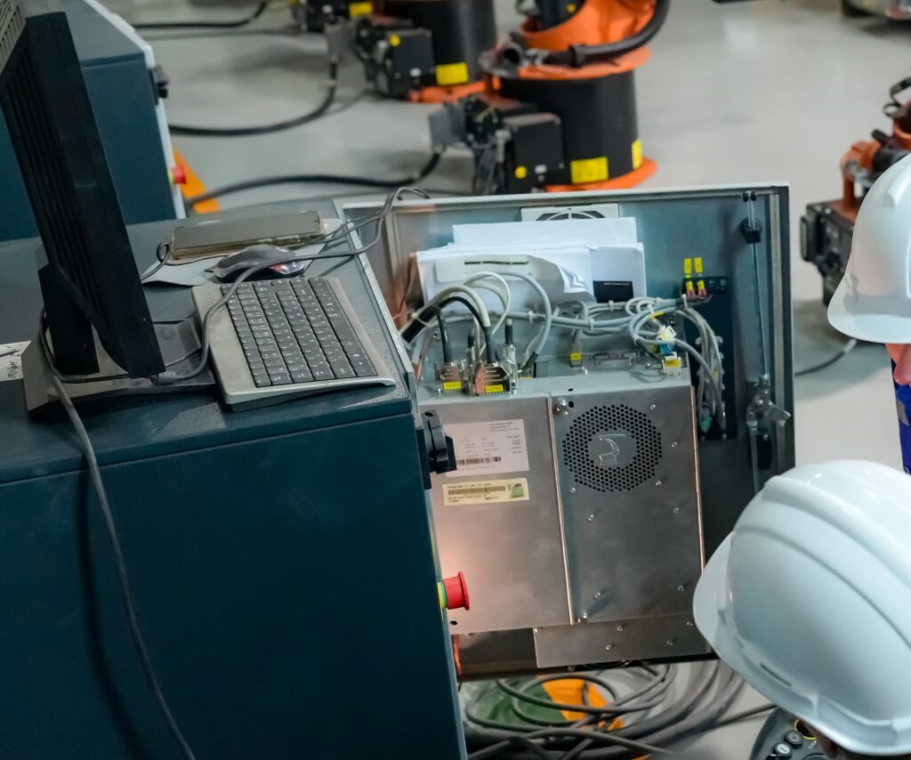 engineer performing an inspection, testing and electrical certification for mechanical equipment